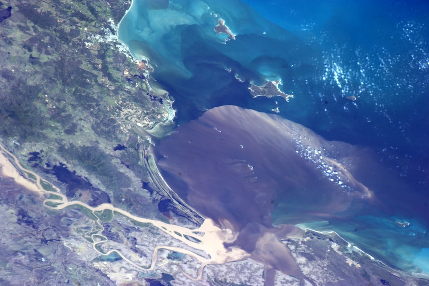 Flood waters entering the Coral Sea near Rockhampton