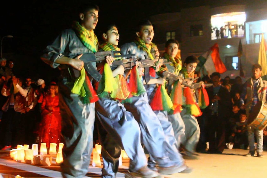 Kurdish fighters dance during Newroz in Afrin, Syria.
