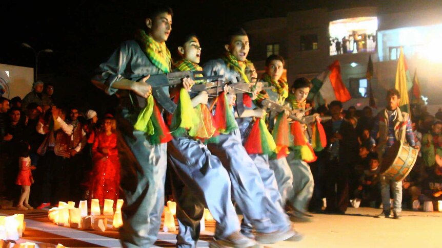 Kurdish fighters dance during Newroz in Afrin, Syria.