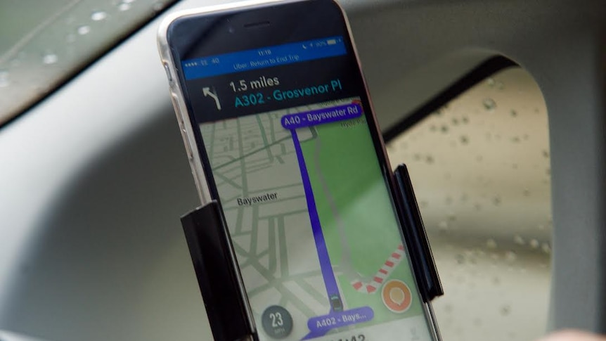 An Uber driver using GPS maps