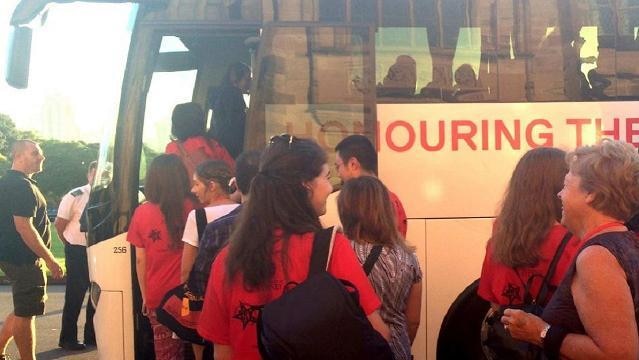 Group of students gets onto bus