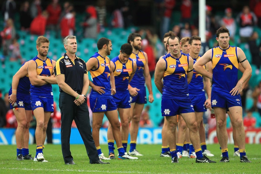 Adam Simpson and the West Coast Eagles look disappointed after loss to Swans
