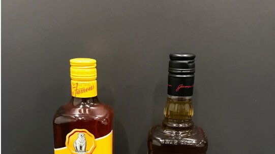 A bottle of Bundaberg rum and Jim Beam.
