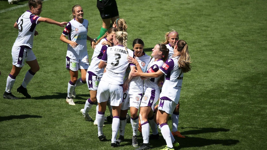 Goalscorer Sam Kerr is surrounded by her happy Perth Glory teammates in a W-League semi-final.