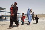 Afghan refugees arrive to be repatriated to Afghanistan, at the UNHCR office on the outskirts of Quetta, Pakistan.