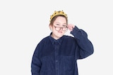 A portrait of Alissia Marsh wearing a crown in front of a white background.