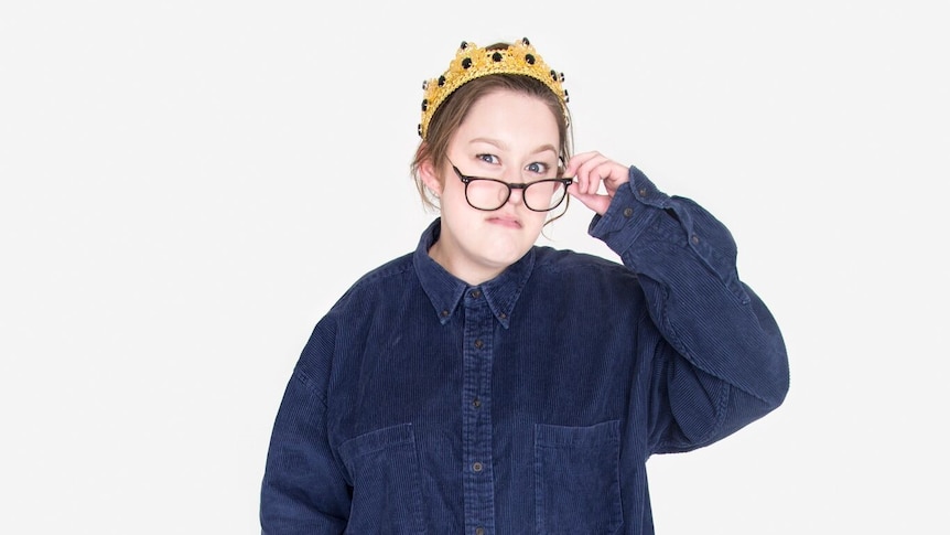 A portrait of Alissia Marsh wearing a crown in front of a white background.