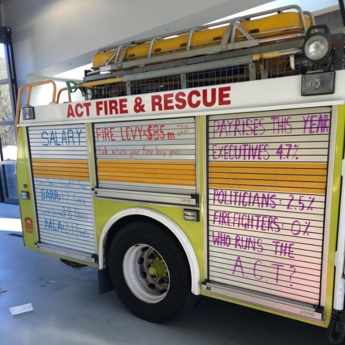Writing about pay disputes on an ACT Fire and Rescue truck.