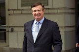 Paul Manafort, President Donald Trump's former campaign chairman, leaves court in a suit.
