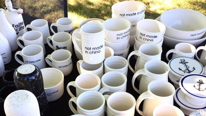 A pile of cups and bowls printed with the words "not made in China".