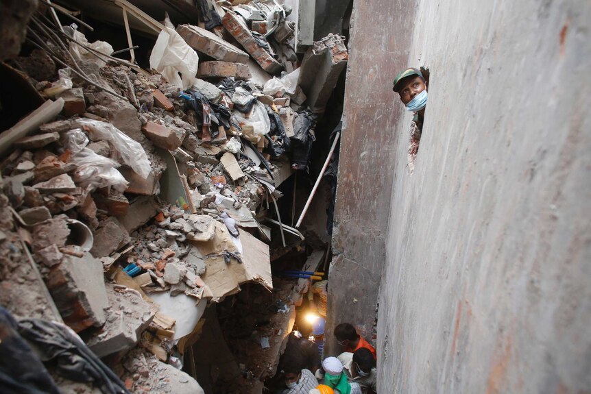 Rescue workers look for trapped garment workers in Bangladesh