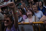 Women shout slogans during a protest outside the Justice Ministry in Madrid.