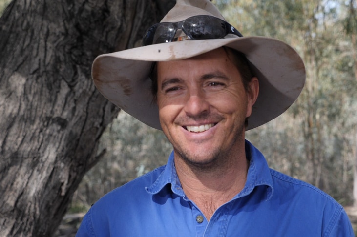 Michael Marshman standing in the bush on his property.