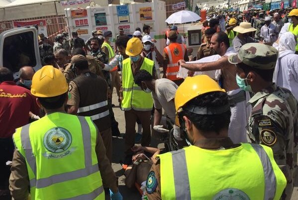Authorities at the scene of a pilgrim crush outside Mecca