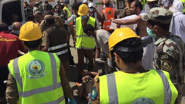 Authorities at the scene of a pilgrim crush outside Mecca
