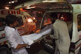 Relatives shift the dead body of a heatwave victim in Pakistan