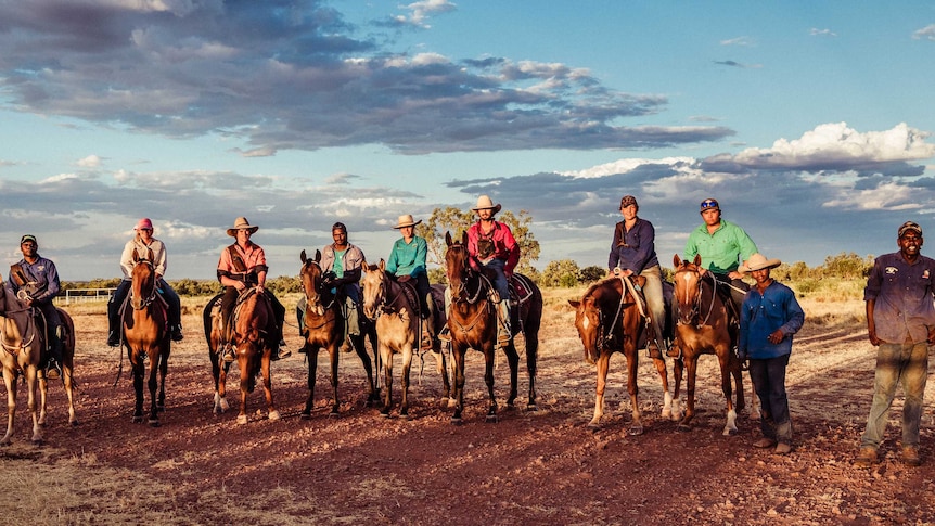 Ten stockmen and women and their horses at Mistake Creek WA.