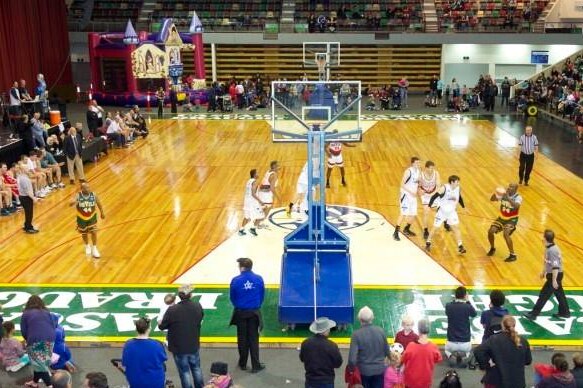 Basketball players on court during a match at Hobart's Derwent Entertainment Centre in 2014.