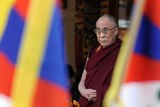 Semi-retired: the Dalai Lama offers prayers at his palace temple