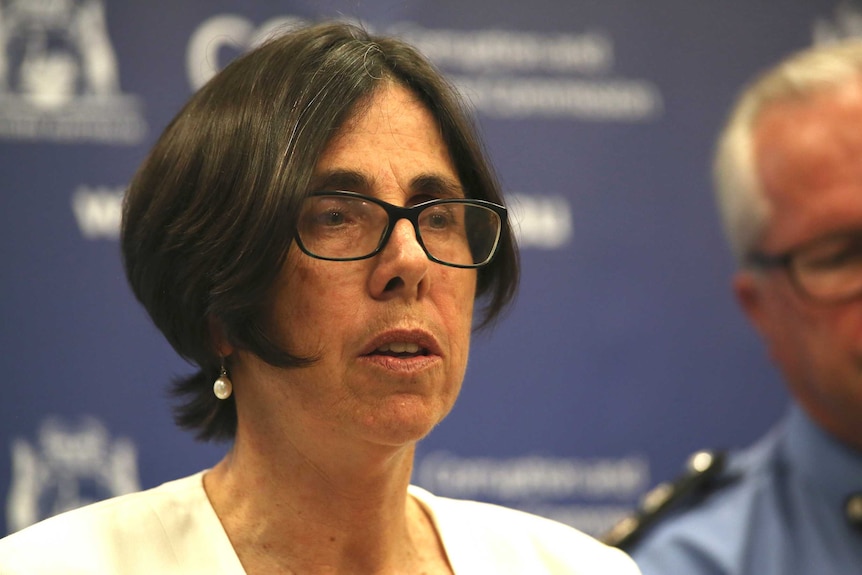 A head shot of Michelle Andrews speaks at the police conference on the allegations.