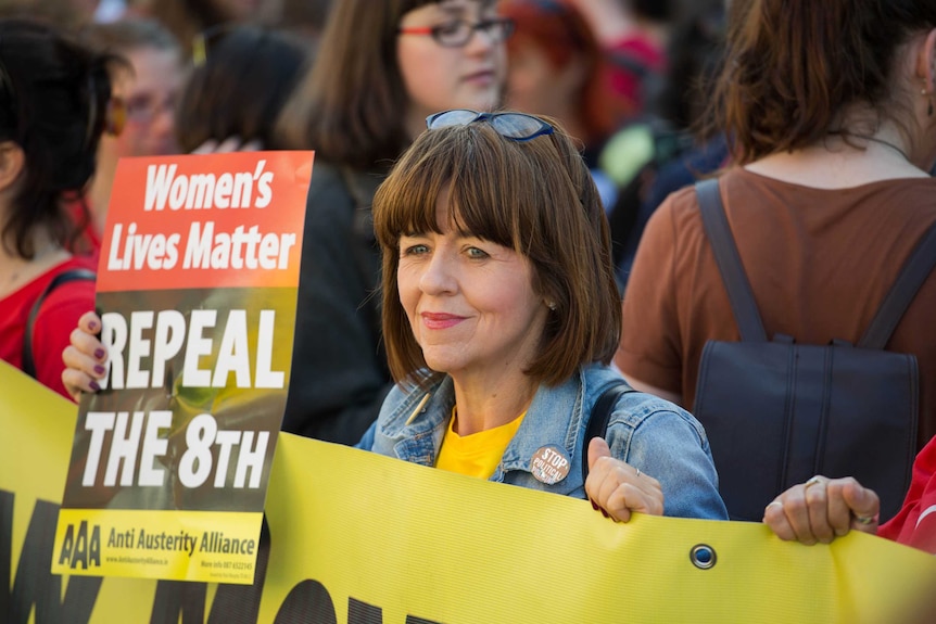 A close shot of a woman holding a pro abortion rights placard at a rally in Ireland, 2015.