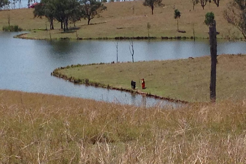 SES retrieve an oar from Somerset Dam, north-west of Brisbane in search for missing man