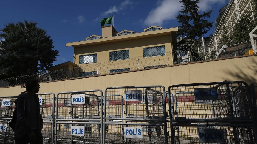 A man walks past the Saudi Arabia consulate in Istanbul.