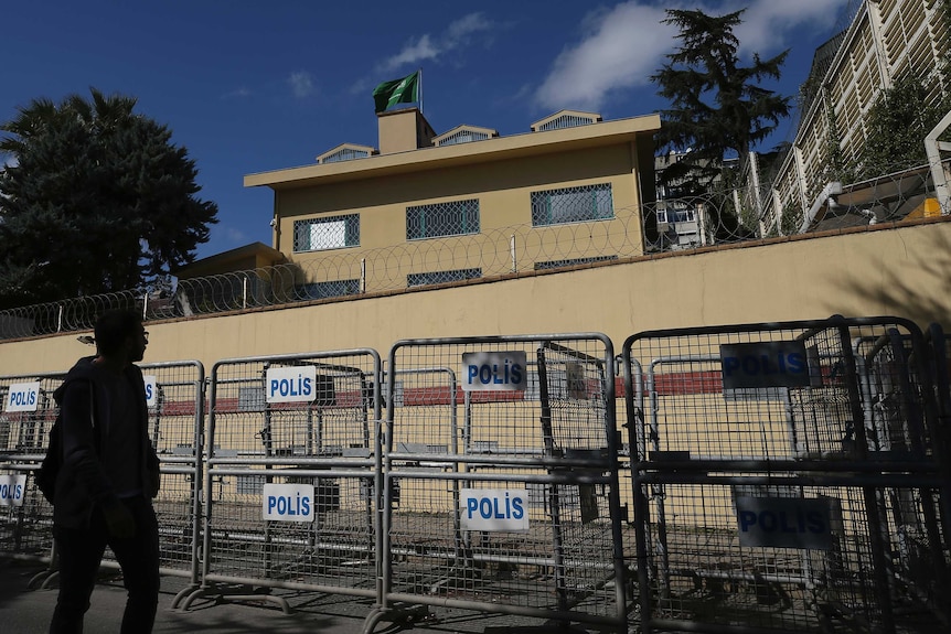 A man walks past the Saudi Arabia consulate in Istanbul.