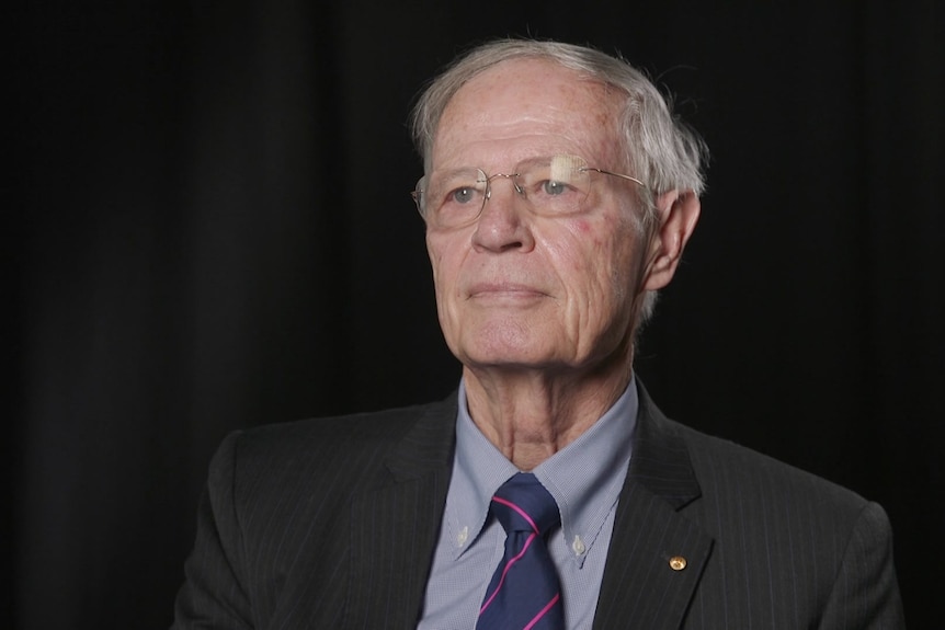 A man wearing a suit and tie.