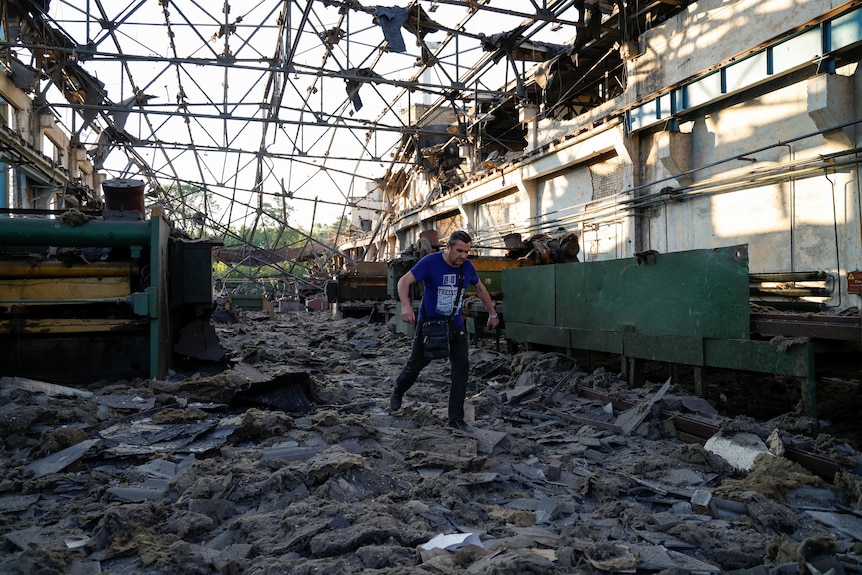 The interior of a destroyed factory full of rubble. 