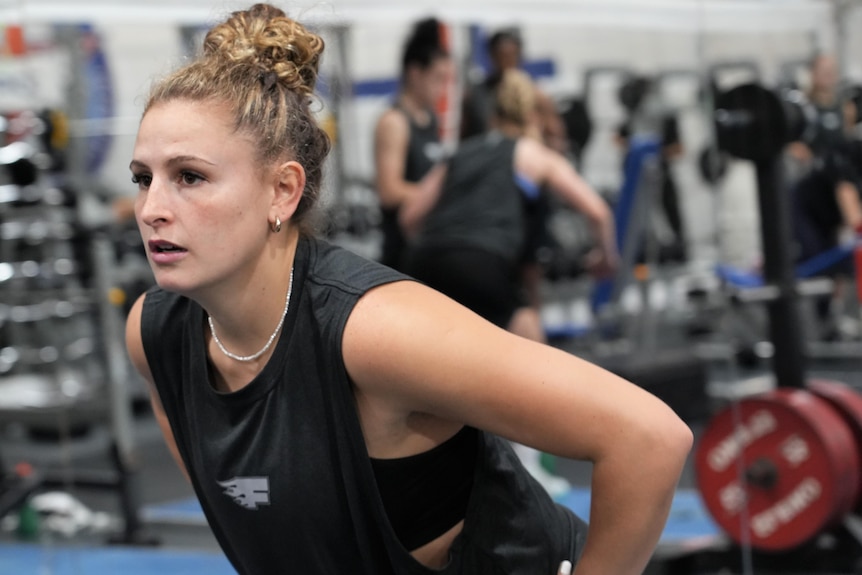 Close up of Tiana Mangakahia doing gym exercises