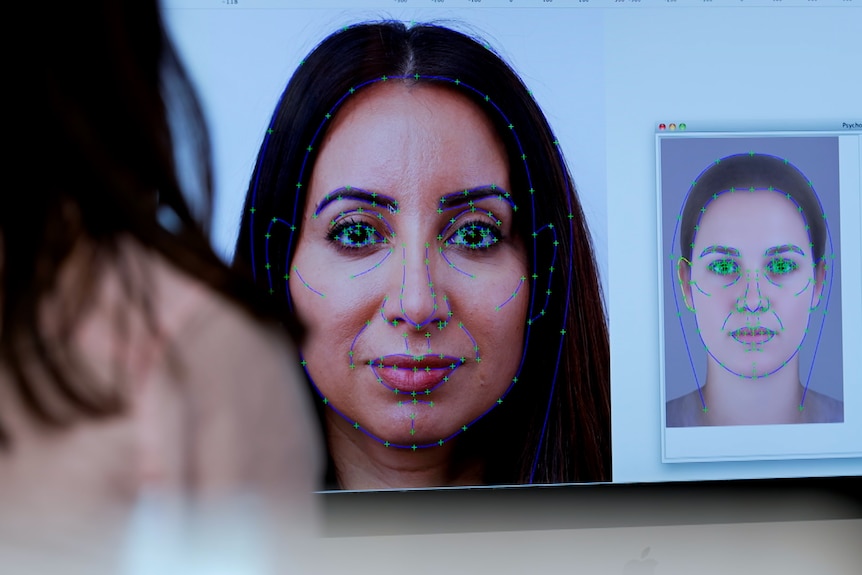 Woman's face with green dots on it