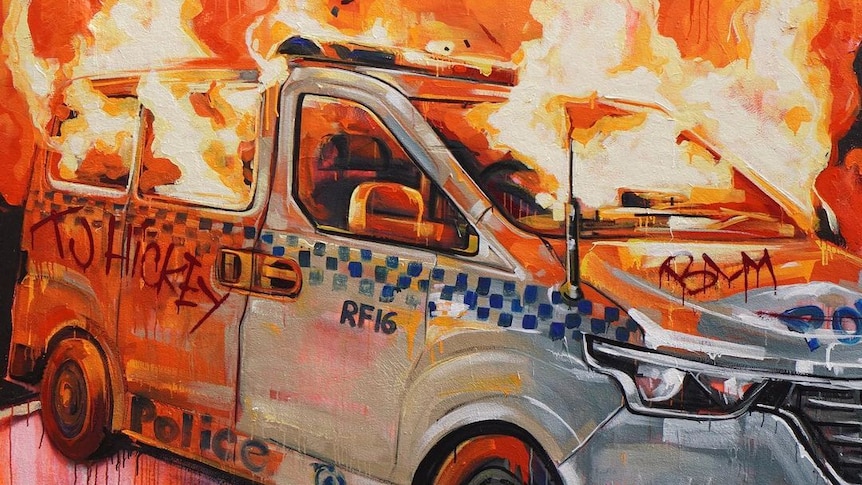 A mural of a burning Redfern police car.