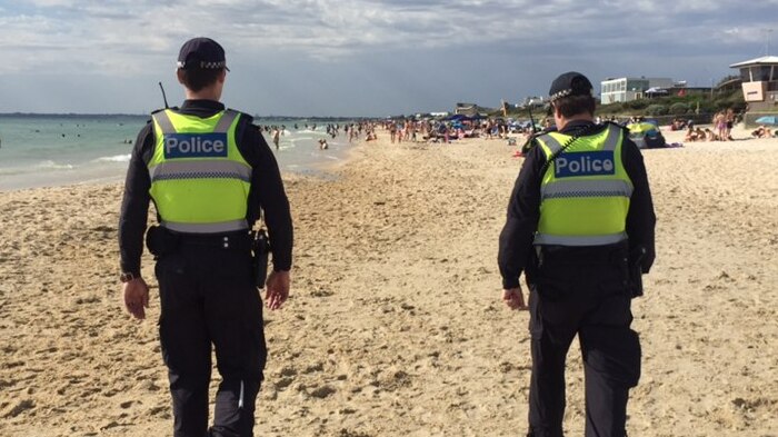 Two police patrol Chelsea beach.