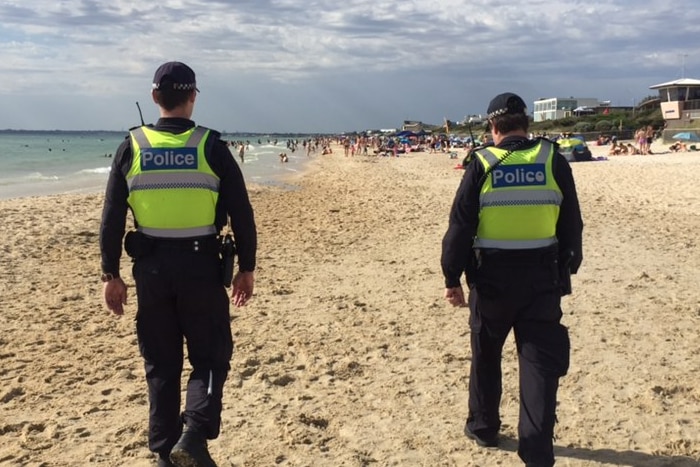 Two police patrol Chelsea beach.