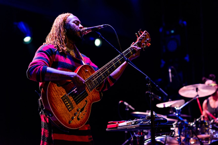 Thundercat plays his bass and sings at the mic at Melbourne's Forum for RISING festival 2023