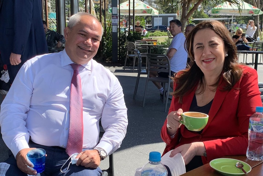 Annastacia Paszczuk and Tom Tate seated outside having a coffee