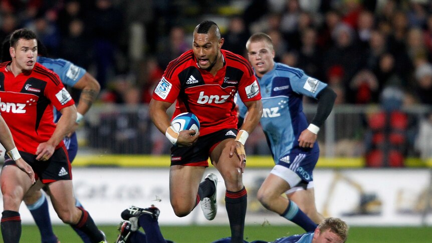 Left for dead ... Robbie Fruean streaks away from the Blues' defence in Christchurch.