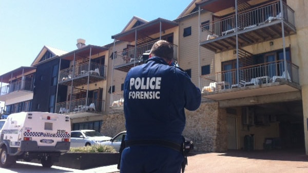 An officer outside the Sunmoon resort in Scarborough where Preston Bridge fell from a 2nd floor balcony and died.