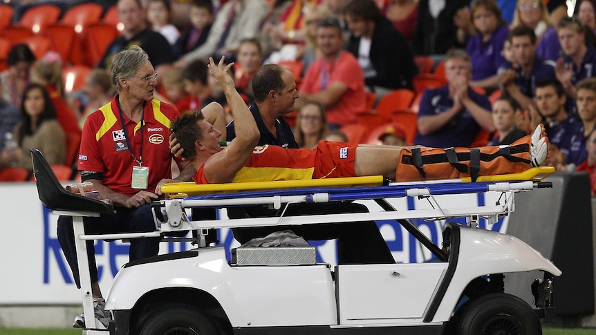 Nathan Bock stretchered from the field