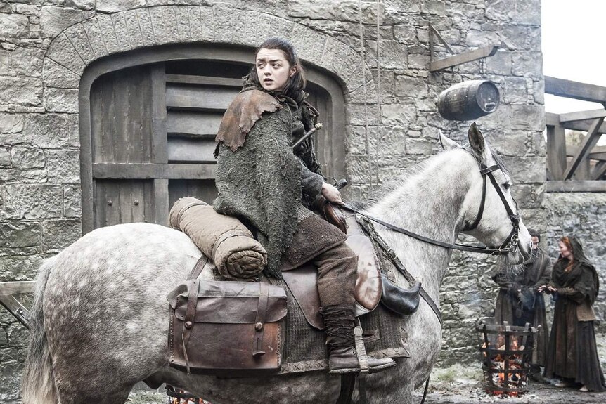 Actress Maisie Williams rides a horse in a still image of the television show Game of Thrones