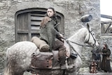 Actress Maisie Williams rides a horse in a still image of the television show Game of Thrones