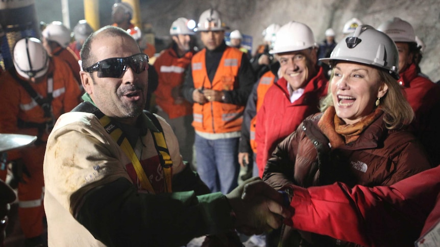 Mario Sepulveda celebrates after reaching the surface at the San Jose mine.