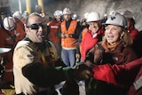 Mario Sepulveda celebrates after reaching the surface at the San Jose mine.