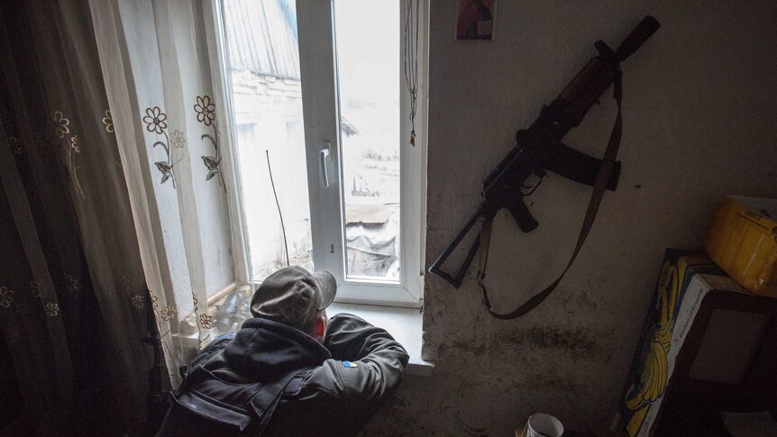 Ukrainian soldier watches over no man's land.