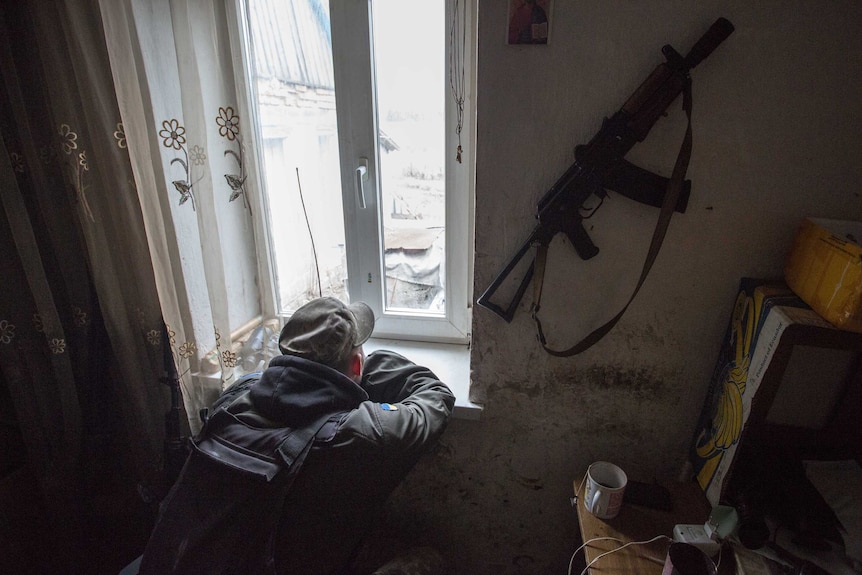 Ukrainian soldier watches over no man's land.