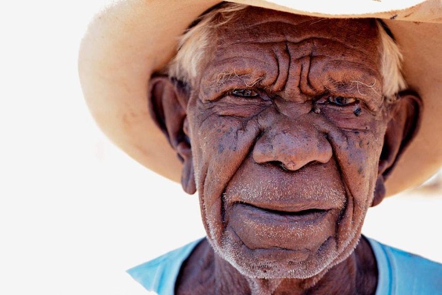 A close-up portrait of Indigenous man Jimmy Wavehill.