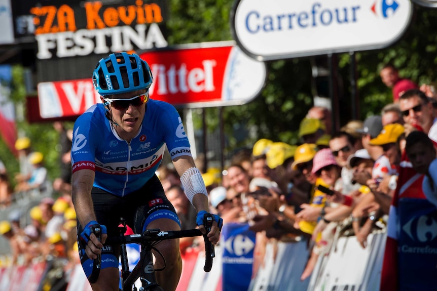 Andrew Talansky crosses the finish line after the 11th stage of the Tour de France