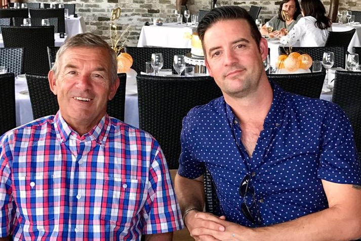 Ray and John Daniels sitting together at a restaurant table