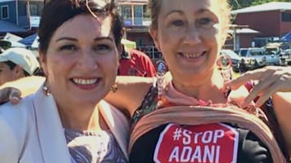 Queensland Environment Minister Leeanne Enoch with an anti-Adani campaigner on June 15, 2019.